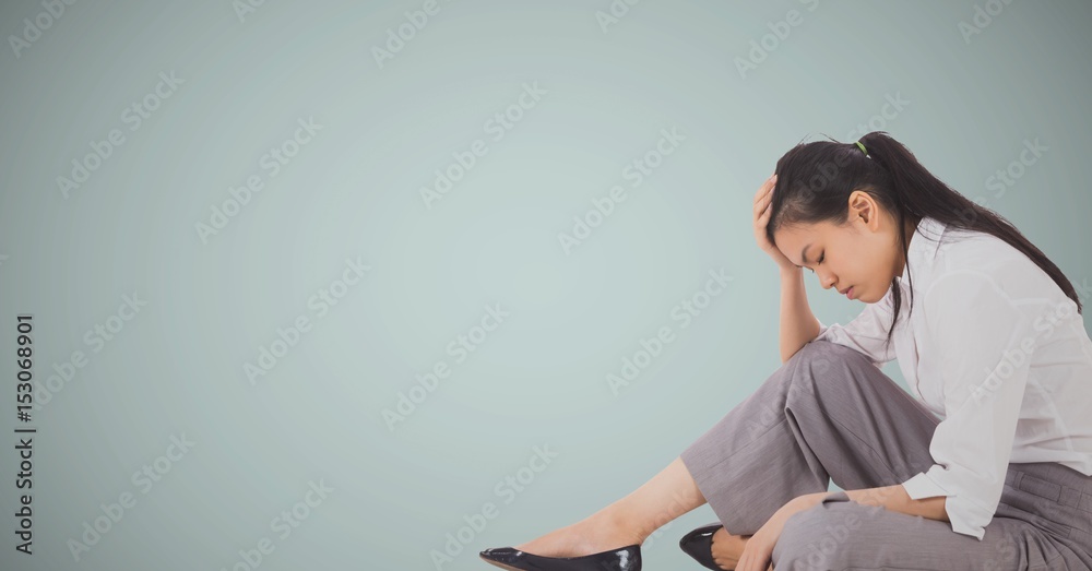 Obraz premium Business woman sitting with head on hand