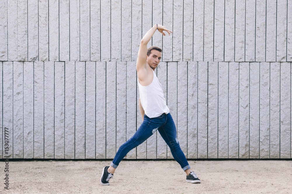 Obraz premium male dancer exercising on a balance casual pose