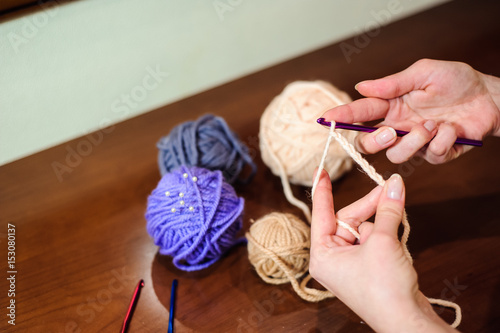 Close up of hands knitting. Process of knitting.