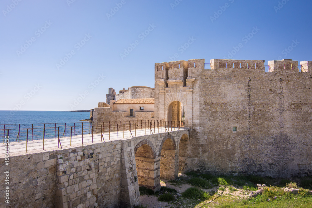 Scenic view of Maniace castle on sea, Ortigia island, Syracuse, Sicily, Italy.