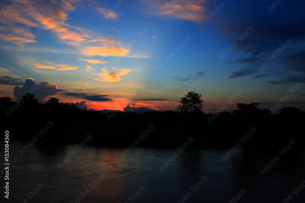 sunset in sky beautiful colorful landscape  silhouette tree woodland and river reflect  the twilight time