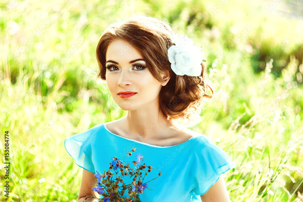 Girl in a dress in the woods