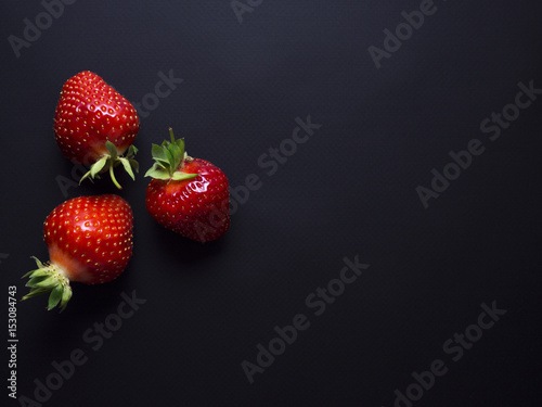 Fresh, red, ripe strawberries isolated on black background