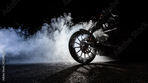 High power motorcycle chopper with man rider at night © Jag_cz