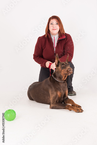 Owner of female brown dog sitting isolated studio photo