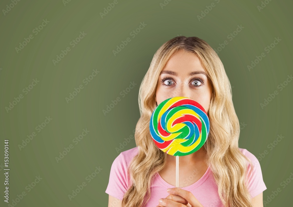 Woman with lollipop over green background