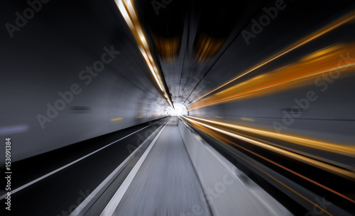 Traffic rushing through a modern tunnel. High speed concept.