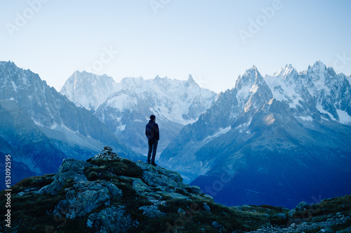 Man looking at the mountains near Chamonix, France. Old film style. photo