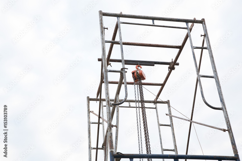 Industrial hook hanging on reel chain Industrial hook hanging on reel chain