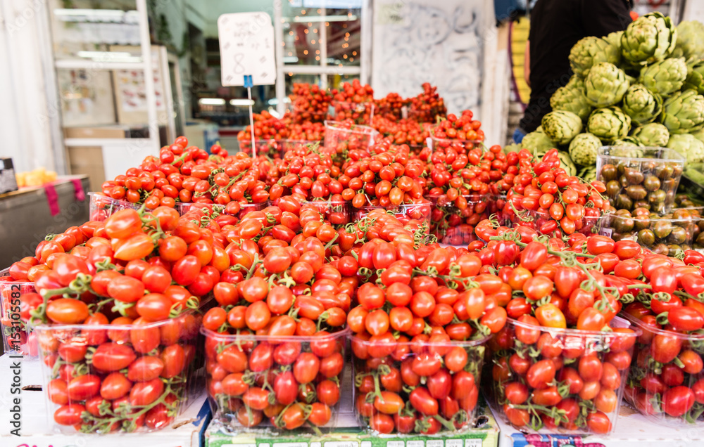 Fresh ripe cherry tomatoes in a market stall