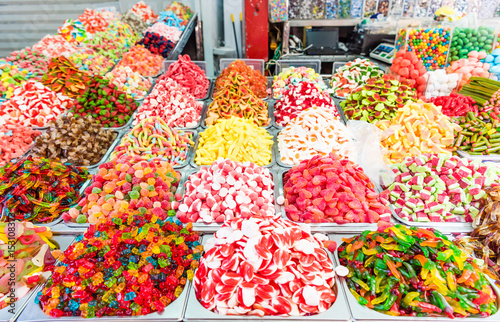 Assorted colorful gummy candies at market photo