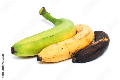 A picture of three ordinary bananas, without modifications..as you know from the shop. The picture shows the maturing of the bananas. One is green, one is yellow and one is overripened.  photo