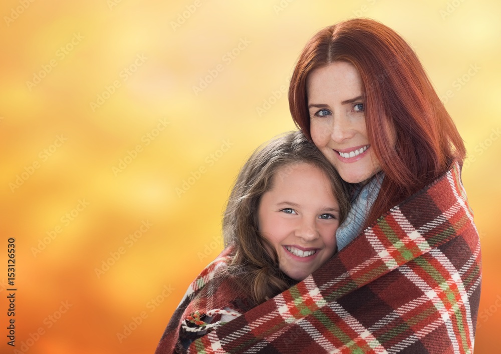 Obraz premium Mother hugging daughter against background
