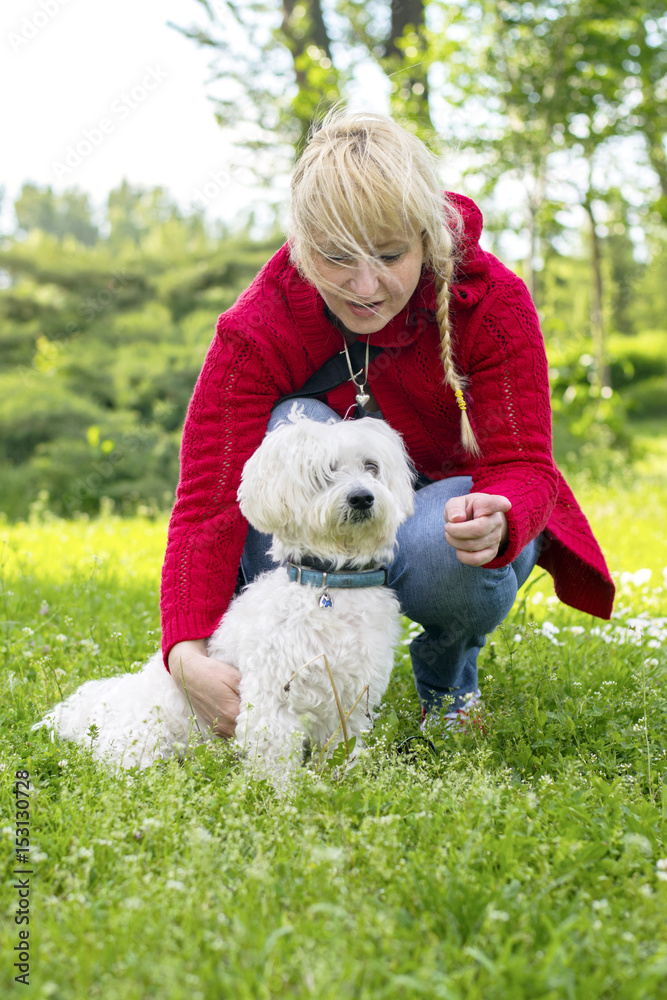 Woman with a dog in the park Woman with a dog in the park