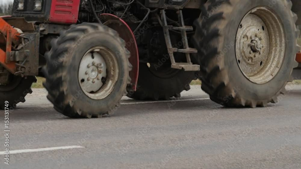Tractor - road service clean up the roadside on countryside road. Tractor - road service clean up the roadside on countryside road.