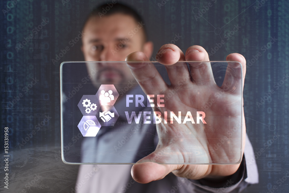 Fototapeta premium Business, Technology, Internet and network concept. Young businessman working on a virtual screen of the future and sees the inscription: Free webinar