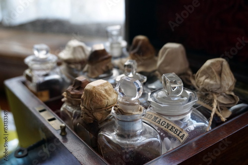 Old wooded case containing bottles and phials of medicine, including Magnesia