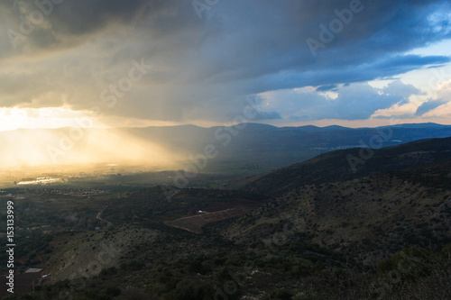 Magnificent view of the Golan Heights, the rays of the setting sun make their way through the clouds © evgeny_pylayev