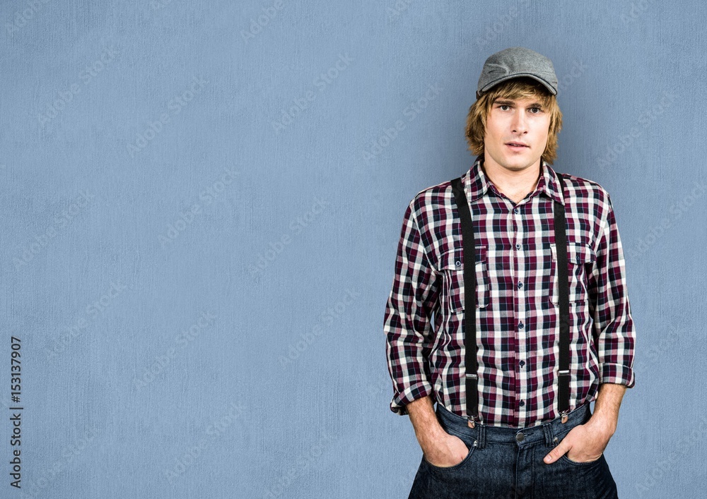 Male with hands in pockets over blue background Male with hands in pockets over blue background