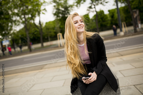 Cute young woman on the str...