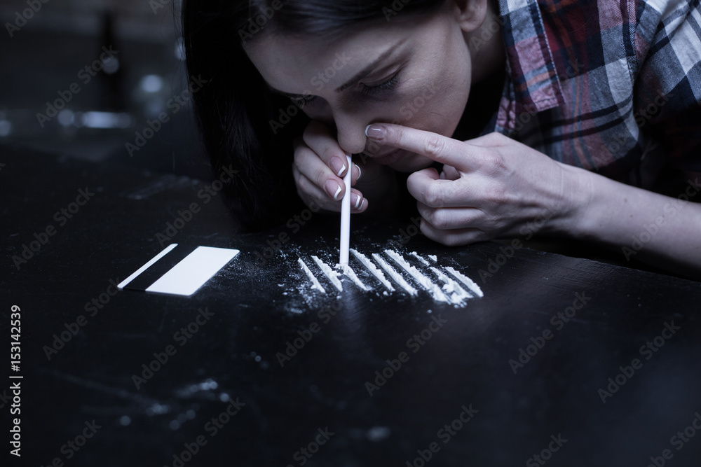 Drug addict snorting heroin lines in the dark place Stock Photo | Adobe  Stock