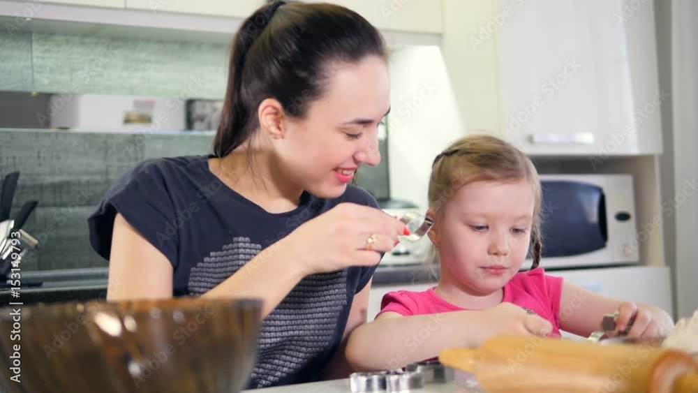 The mother and the child playing with cooking forms. Portrait. Close-up. HD. The mother and the child playing with cooking forms. Portrait. Close-up. HD.
