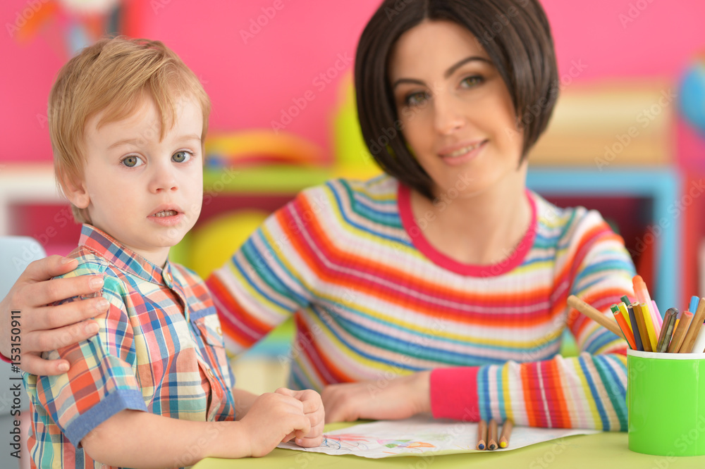 Mother with her son draw with pencils Mother with her son draw with pencils