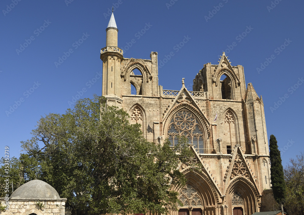 Old church in Famagusta town with blue sky in background