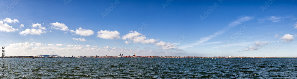 Panoramic view on the harbor of famous Stralsund and its historic churches on a beautiful spring day.