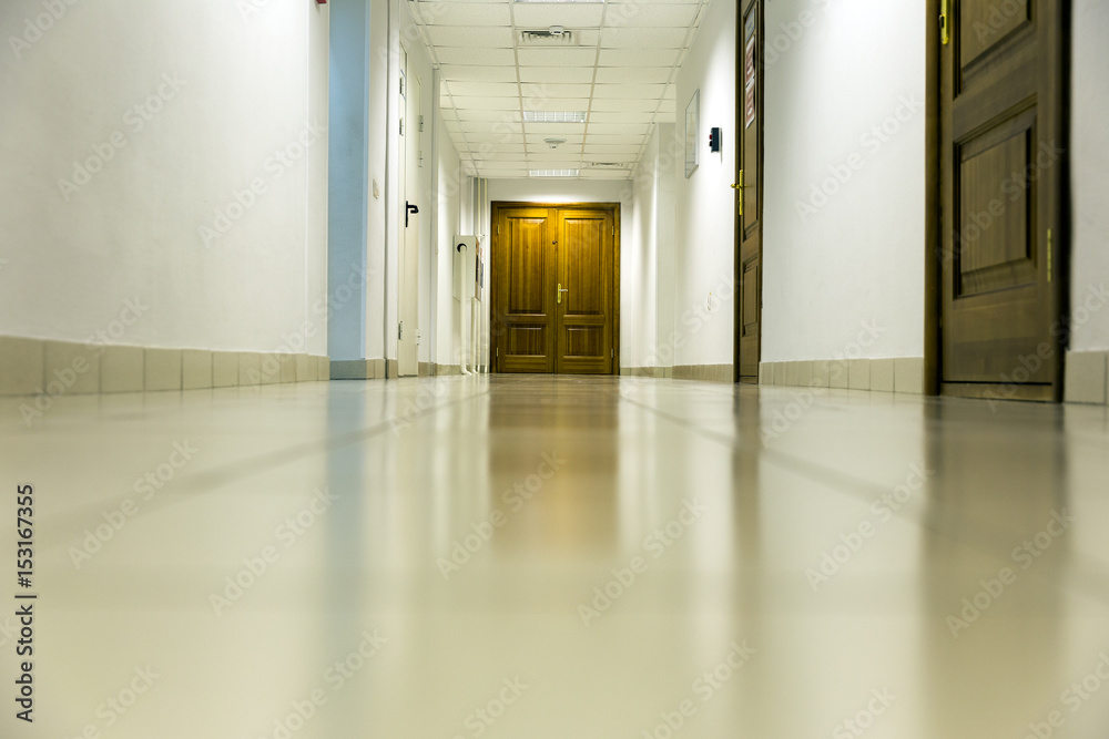 Empty long corridor in the modern office building. background