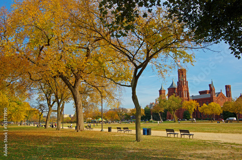 The National Mall in Washington DC in a bright sunny day with Smithsonian Castle at the background