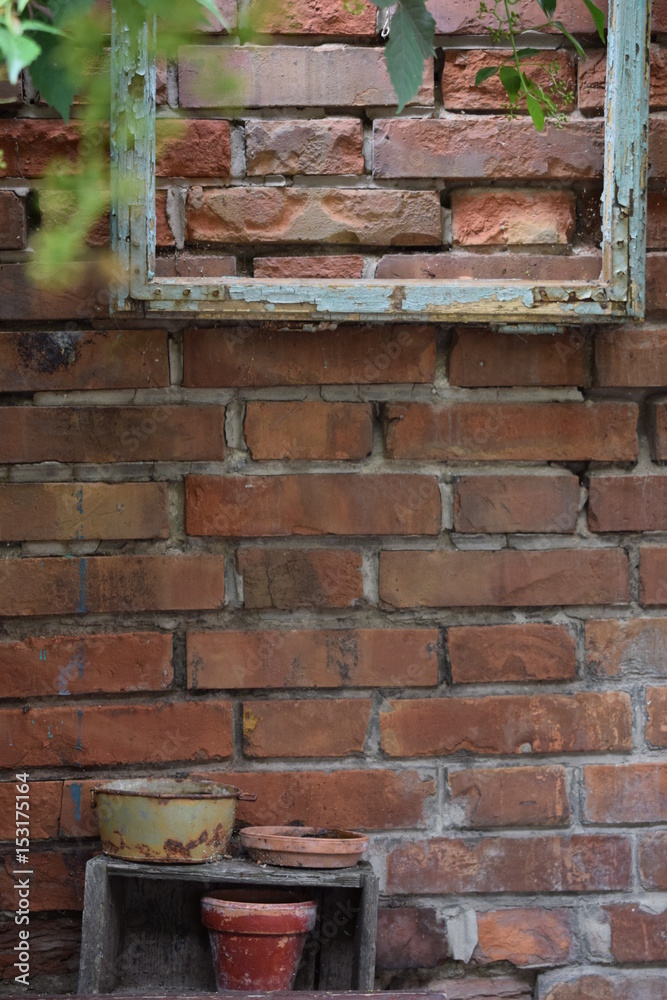wooden frame on a brick wall in the garden wooden frame on a brick wall in the garden
