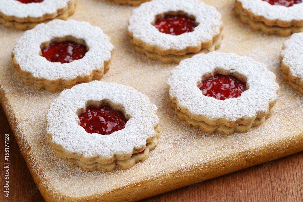 Linzer Torte Cookies Filled With Raspberry Jam on Board Linzer Torte Cookies Filled With Raspberry Jam on Board