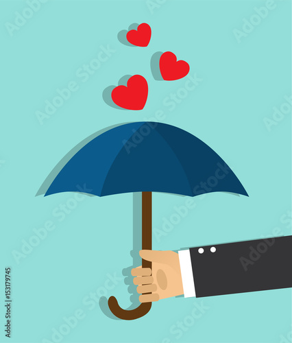The hand holds the open umbrella and the hearts do not get on top of the umbrella