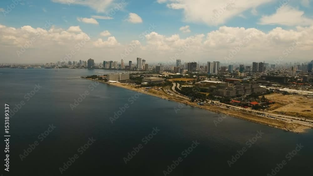 Aerial view of Manila city. Fly over city with skyscrapers and buildings. Aerial skyline of Manila . Modern city by sea, highway, cars, skyscrapers, shopping malls. Aerial footage Makati district. 4K Aerial view of Manila city. Fly over city with skyscrapers and buildings. Aerial skyline of Manila . Modern city by sea, highway, cars, skyscrapers, shopping malls. Aerial footage Makati district. 4K