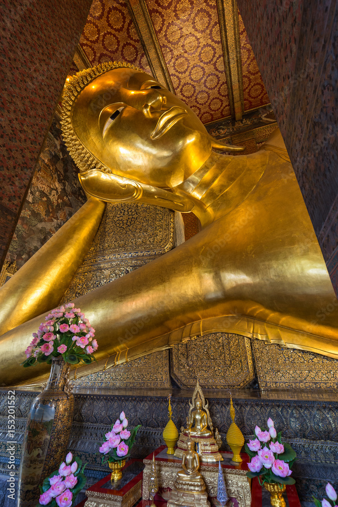 Torso of the famous Reclining Buddha statue at the Wat Pho (Po) temple complex in Bangkok, Thailand.