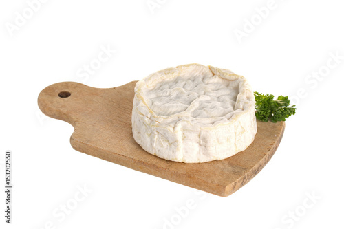 Camembert cheese on a wooden board