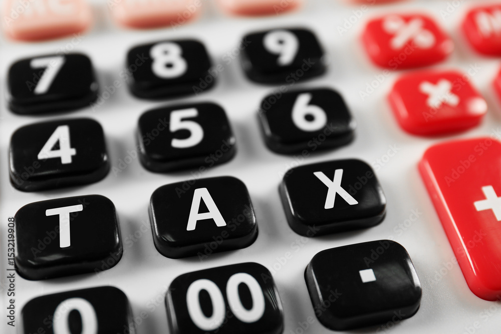 Tax concept. Modern calculator, closeup Tax concept. Modern calculator, closeup
