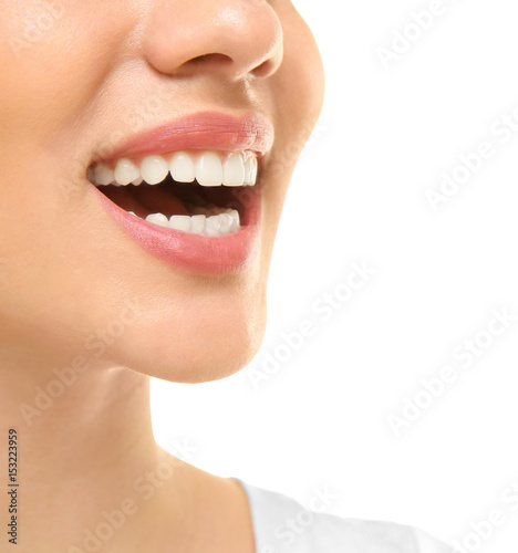 Young beautiful woman smiling on white background. Oral hygiene concept
