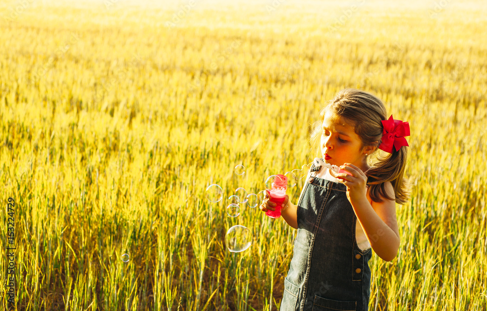 Girl blowing bubbles