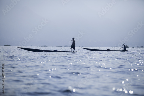 Myanmar,Inle Lake - 09.11.2011: Fishermens at dawn catching fish on Inle Lake