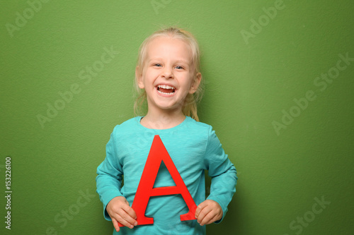 Cute little girl with lette...