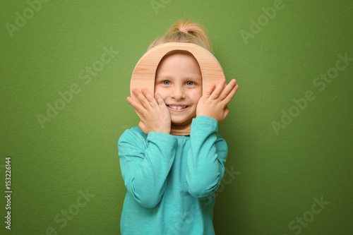 Cute little girl with lette...