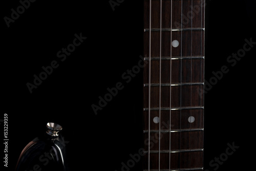 Music and art. Electric guitar on a black isolated background. Horizontal frame photo