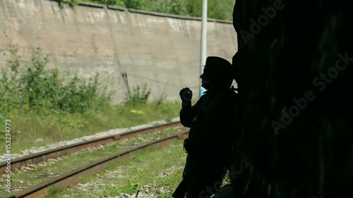 Actor dressed in military uniforms. Soldiers of the Soviet army smokes. The army of the USSR. A soldier with a rifle guarding a railway tunnel.
