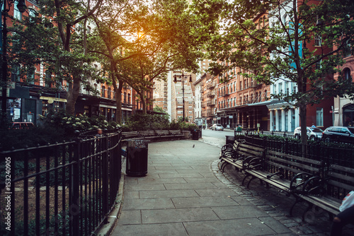 Fototapeta Naklejka Na Ścianę i Meble -  Calm city street park under sunlight in Manhattan, New York City