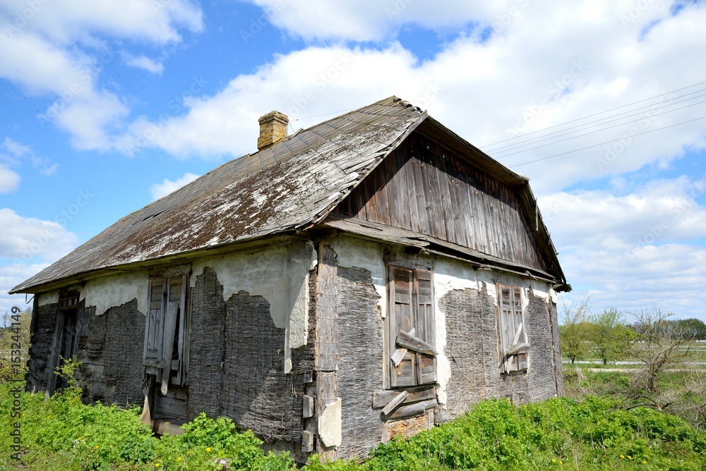 Old wooden abandoned house destroying the wasteland