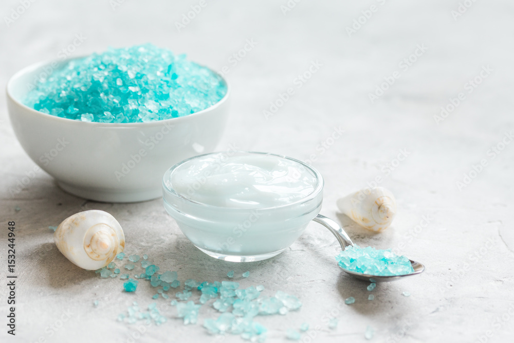 blue set for bath with salt and shells on stone table background blue set for bath with salt and shells on stone table background