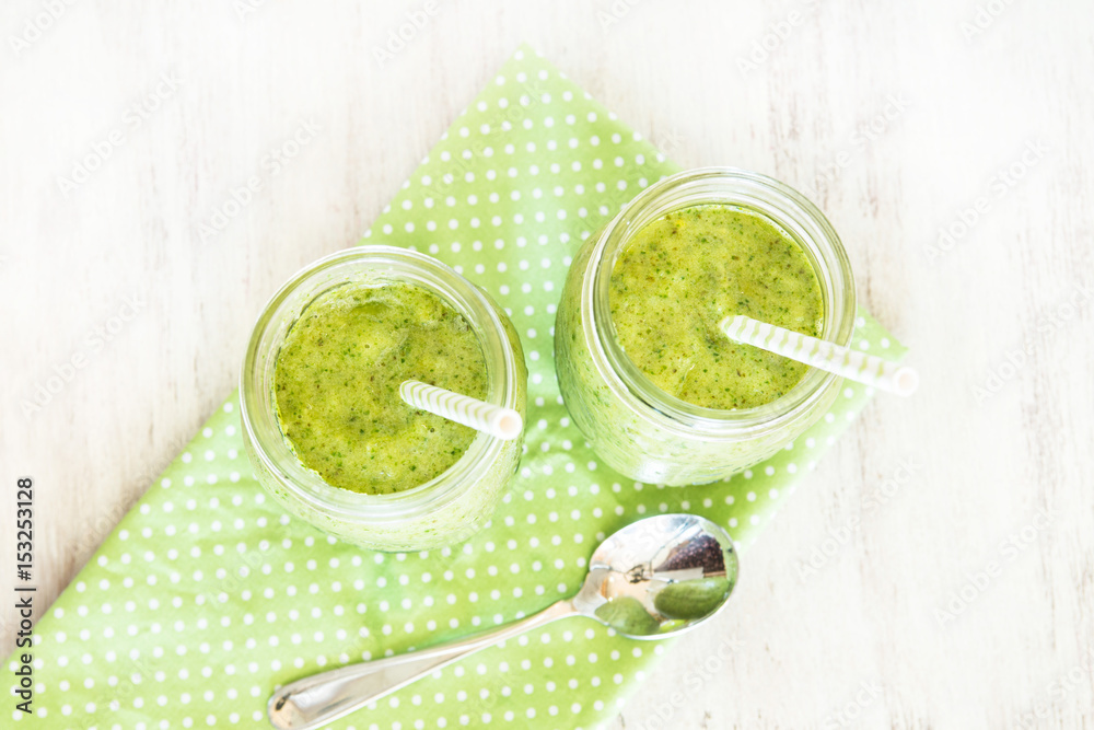 Green Smoothies On Napkin With Straws and Spoon Green Smoothies On Napkin With Straws and Spoon