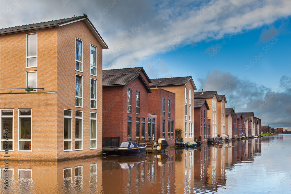 Modern Houses built in the Water in a row Modern Houses built in the Water in a row